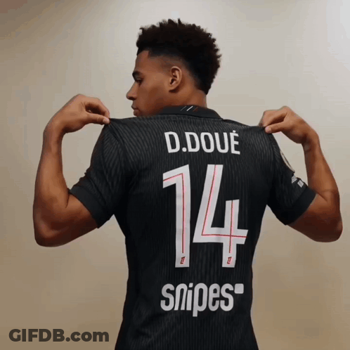 A Soccer Player Wearing A Qatar Jersey Stands On The Field GIF