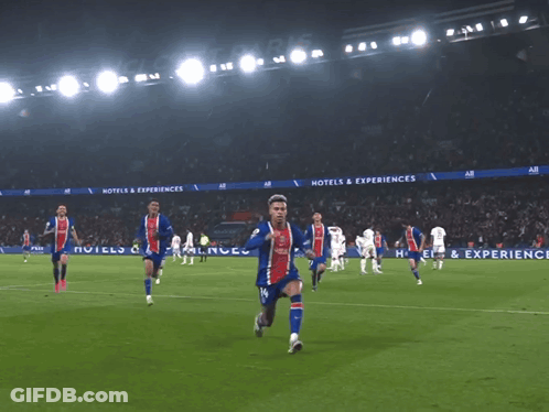 A Soccer Player Wearing A Qatar Shirt Is Kneeling On The Field GIF