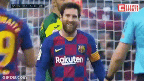A Soccer Player Wearing A Rakuten Jersey Is Smiling While Standing Next To A Referee . GIF