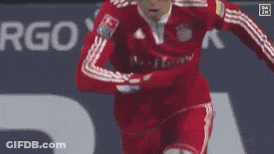A Soccer Player Wearing A Red Adidas Jersey Is Running On The Field GIF
