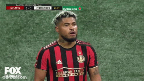 A Soccer Player Wearing A Red And Black Adidas Jersey GIF