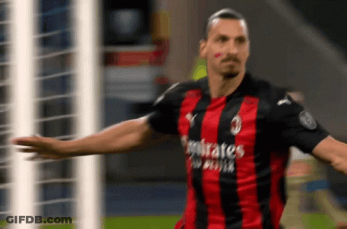 A Soccer Player Wearing A Red And Black Jersey That Says Emirates GIF