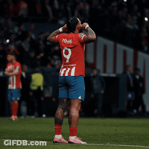 A Soccer Player Wearing A Red And Blue Jersey With The Number 9 On It GIF