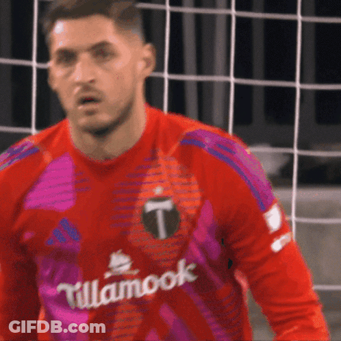 A Soccer Player Wearing A Red And Purple Jersey With Tillamook Written On It GIF