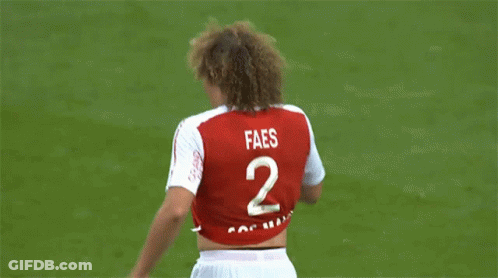 A Soccer Player Wearing A Red And White Jersey That Says Restez A La Maison GIF