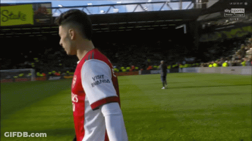 A Soccer Player Wearing A Red And White Jersey That Says Visit Rwanda On The Sleeve GIF