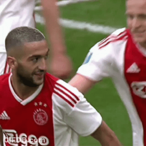 A Soccer Player Wearing A Red And White Jersey That Says Ziggo On It GIF
