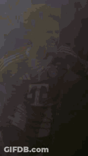 A Soccer Player Wearing A Red And White Jersey With The Letter T On The Front GIF