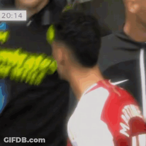 A Soccer Player Wearing A Red And White Jersey With The Name Martin On The Back GIF