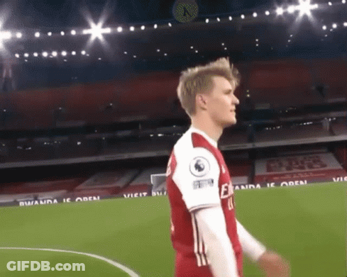 A Soccer Player Wearing A Red And White Jersey With The Number 11 On The Back GIF
