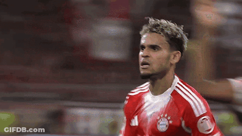 A Soccer Player Wearing A Red And White Jersey With The Number 21 On It GIF