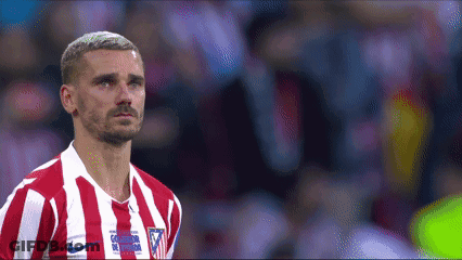 A Soccer Player Wearing A Red And White Striped Jersey With A Nike Logo On The Front GIF