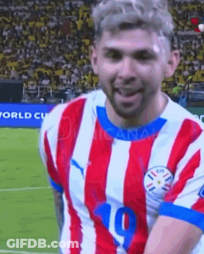 A Soccer Player Wearing A Red And White Striped Jersey With The Number 10 On It GIF