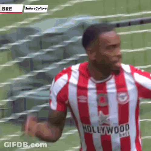 A Soccer Player Wearing A Red And White Striped Jersey With The Word Hollywood On It GIF