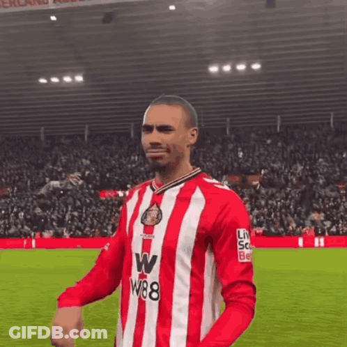 A Soccer Player Wearing A Red And White Striped Jersey With W88 On The Front GIF