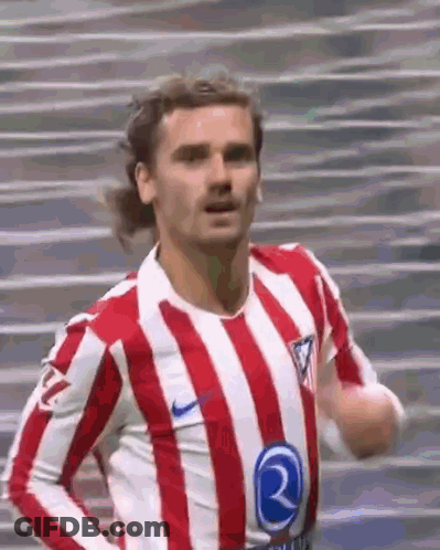 A Soccer Player Wearing A Red And White Striped Shirt Is Running On A Field . GIF