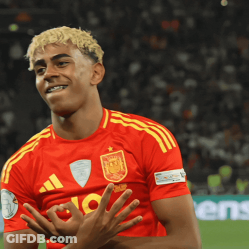 A Soccer Player Wearing A Red And Yellow Jersey With The Number 10 On It GIF