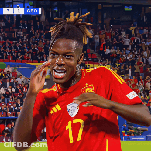 A Soccer Player Wearing A Red And Yellow Jersey With The Number 17 On It GIF