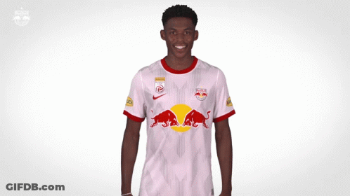 A Soccer Player Wearing A Red Bull Jersey Is Making A Funny Face GIF