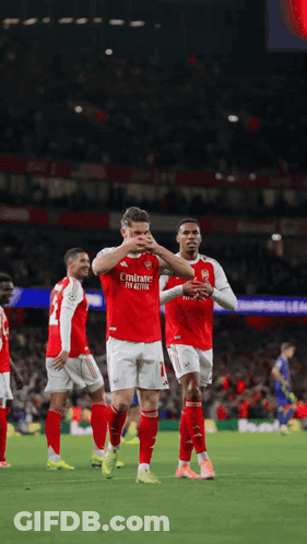 A Soccer Player Wearing A Red Emirates Fly Emirates Jersey GIF