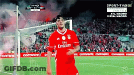 A Soccer Player Wearing A Red Emirates Jersey Stands On A Field GIF