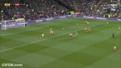A Soccer Player Wearing A Red Jersey That Says Emirates Fly Emirates On It GIF