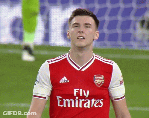 A Soccer Player Wearing A Red Jersey That Says Fly Emirates On It GIF