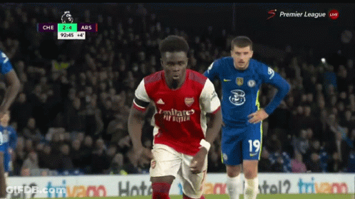 A Soccer Player Wearing A Red Jersey That Says Fly Emirates On It GIF