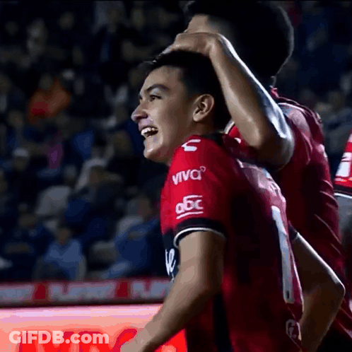 A Soccer Player Wearing A Red Jersey That Says Viva On It GIF