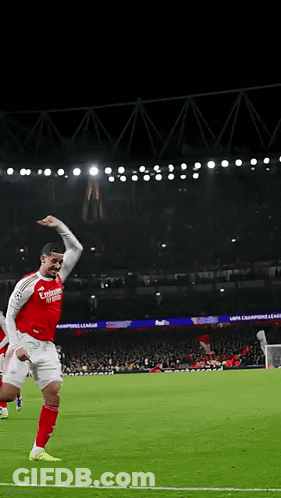 A Soccer Player Wearing A Red Jersey With Emirates Written On It Celebrates A Goal GIF