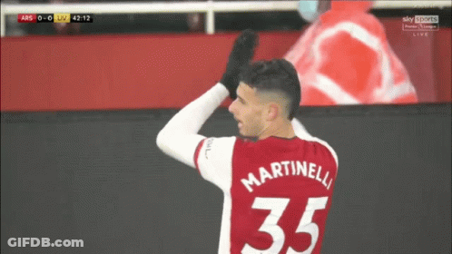 A Soccer Player Wearing A Red Jersey With Martinelli 35 On It GIF