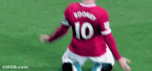 A Soccer Player Wearing A Red Jersey With The Number 10 On The Back Is Kneeling Down On The Field . GIF