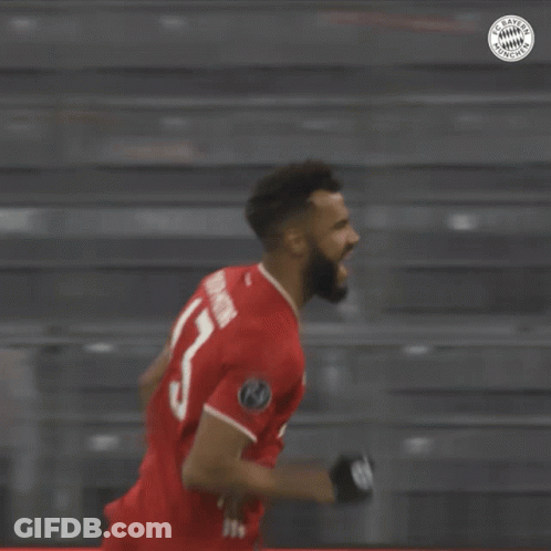 A Soccer Player Wearing A Red Jersey With The Number 14 On It GIF