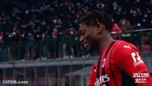 A Soccer Player Wearing A Red Jersey With The Number 14 On It GIF