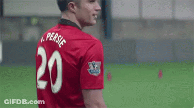 A Soccer Player Wearing A Red Jersey With The Number 20 On The Back Is Smiling . GIF