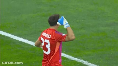 A Soccer Player Wearing A Red Jersey With The Number 23 On The Back GIF