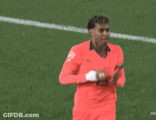 A Soccer Player Wearing A Red Jersey With The Number 27 On It Is Running On The Field . GIF