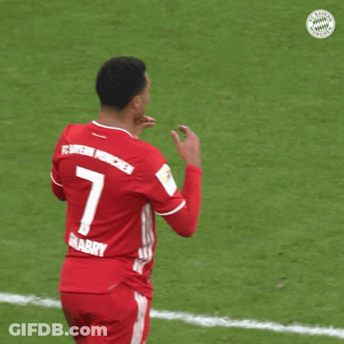 A Soccer Player Wearing A Red Jersey With The Number 7 On The Back GIF