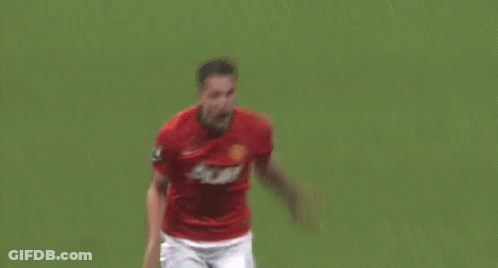 A Soccer Player Wearing A Red Jersey With The Number 8 On It Is Kneeling Down On The Field . GIF