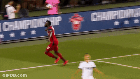 A Soccer Player Wearing A Red Jersey With The Number 8 On It GIF