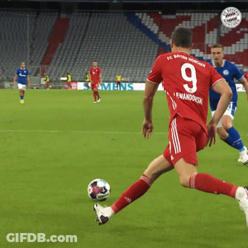 A Soccer Player Wearing A Red Jersey With The Number 9 On It GIF