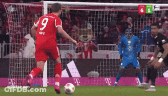 A Soccer Player Wearing A Red Jersey With The Number 9 On It GIF