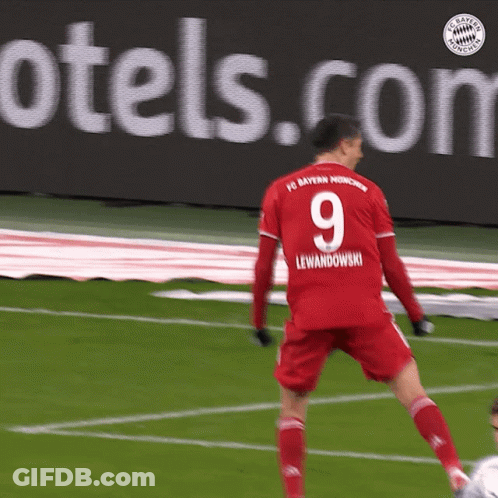 A Soccer Player Wearing A Red Jersey With The Number 9 On It GIF