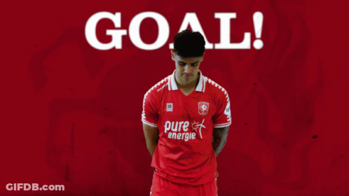 A Soccer Player Wearing A Red Pure Energie Shirt Celebrates A Goal GIF