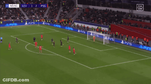 A Soccer Player Wearing A Red Qatar Jersey Is Pointing At Something GIF