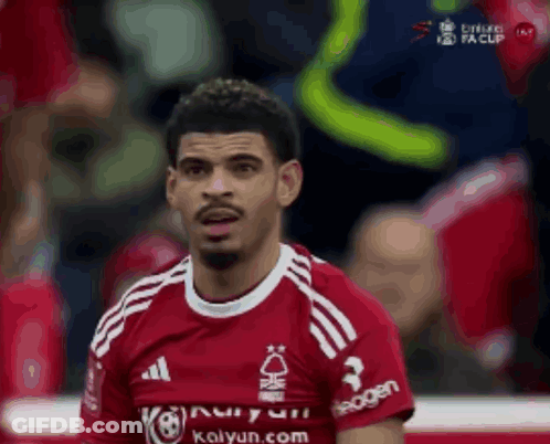 A Soccer Player Wearing A Red Shirt That Says Kalyun.com On It GIF