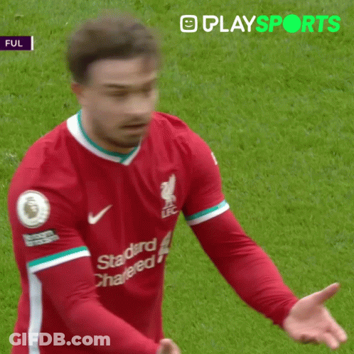 A Soccer Player Wearing A Red Shirt That Says Standard Chartered GIF