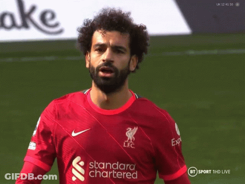 A Soccer Player Wearing A Red Shirt That Says Standard Chartered On It GIF