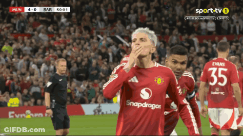 A Soccer Player Wearing A Red Shirt With Snapdragon On It GIF