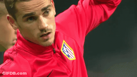 A Soccer Player Wearing A Red Shirt With The Letters Atm On It Is Standing On A Field . GIF